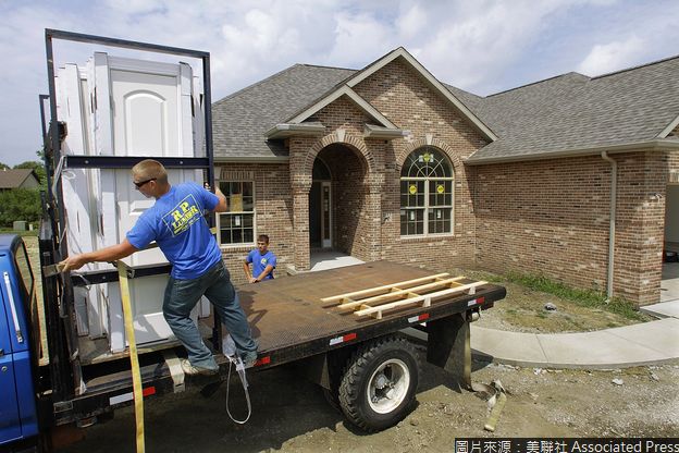In this July 15, 2010 photo, construction workers Brian Stocks, left, and Cody Marinelli, right, unload doors to a new home under construction in Springfield, Ill. Excluding volatile food and energy prices, the so-called "core" index increased by 0.1 percent in July, as the cost of housing, clothes, and used cars and trucks all rose. (AP Photo/Seth Perlman)